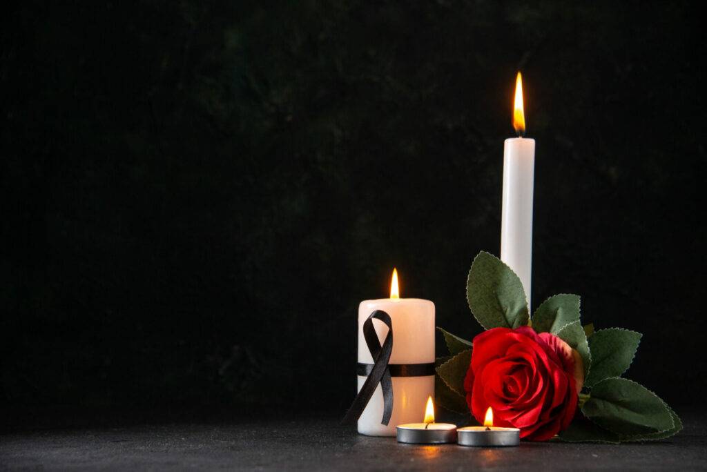 Obituary Burning Candles With Red Flower